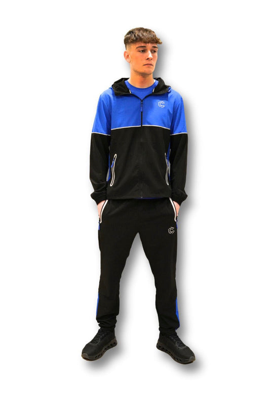 Full-length front view of the Courex Strive Tracksuit in black and blue